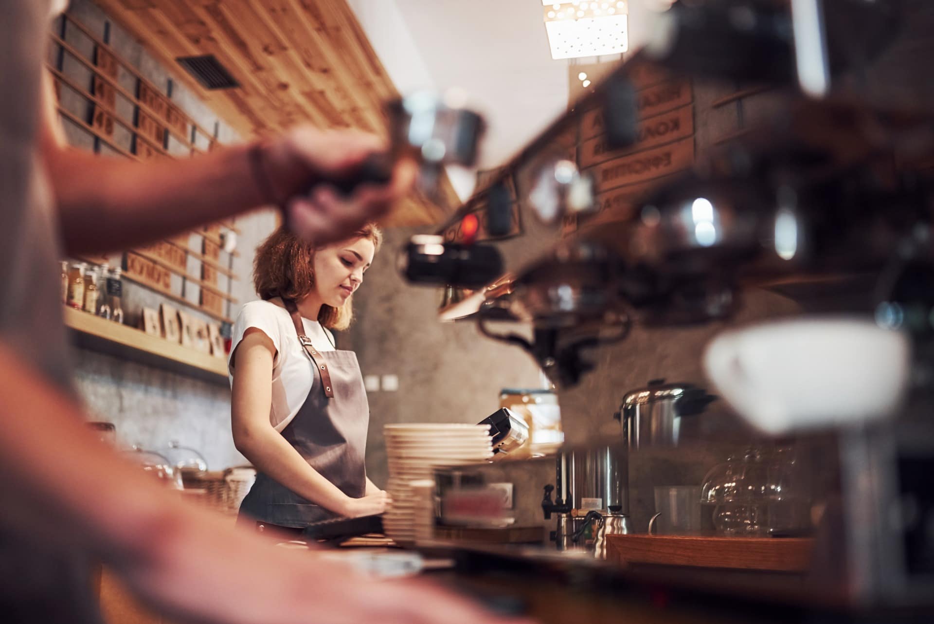 A barista pulling a shot